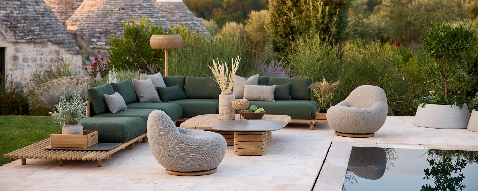 Green Outdoor Sofa with Teak Accents, Teak Coffee Table and Comfy Curved Lounge Chairs